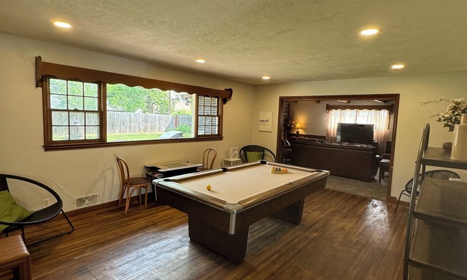 Wichita Casa | Experience Wichita living near WSU! Fire Pit, Pool Table, and Arcade games.