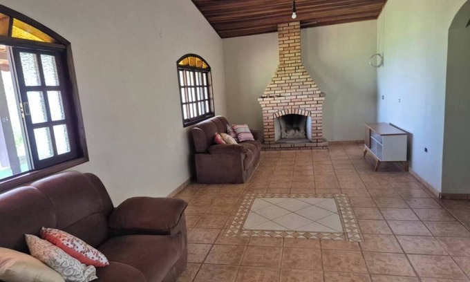 Mato do Gado Casa | Farm with swimming pool, fireplace and gourmet space surrounded by greenery.