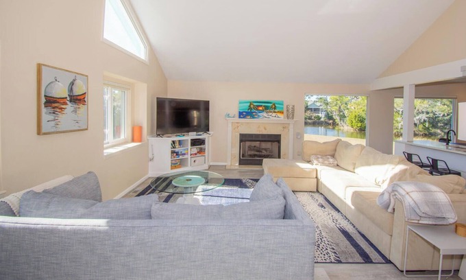 Blue Heron Lake Casa | Fenced backyard w/ pond, fire pit, screened porch, ping pong, Golf cart incl.
