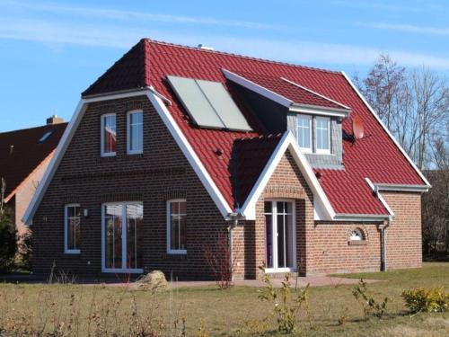 Middelsbur Casa | Ferienhaus in Dornum am Wasserschloss