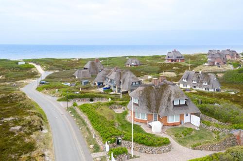 Rantum Casa | Ferienhaus Seehaus Sylt - Urlaubszauber in den Dünen mit fantastischem Meerblick