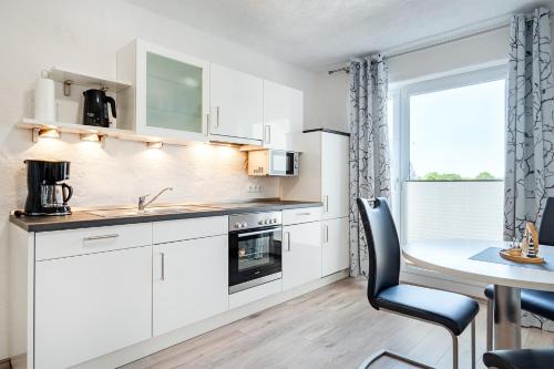 Tannenhausen Apartamento | Ferienwohnung Flut mit Loggia und schönem Ausblick am Badesee Tannenhausen