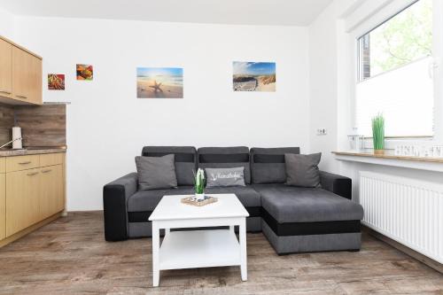 Neuharlingersiel Apartamento | Ferienwohnungen Haus Boje "Wattwurm"