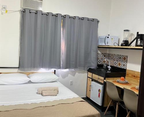 Jardim Ipe Apartamento | Flat com ar e varanda com linda vista para o Ibituruna - Vôo Livre 203
