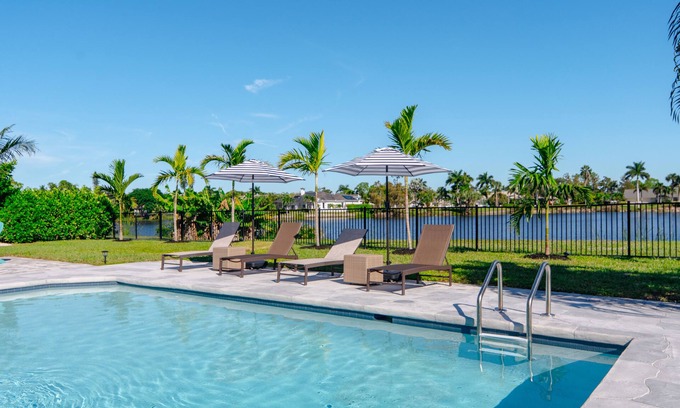 Palm River Estates Casa | Fully Updated Lake Front Home With Heated Pool!
