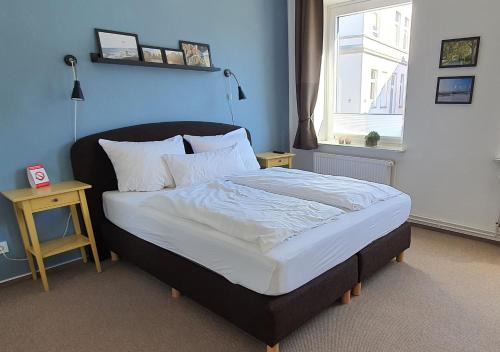 Schleswig Apartamento | Gästehaus bed & kitchen