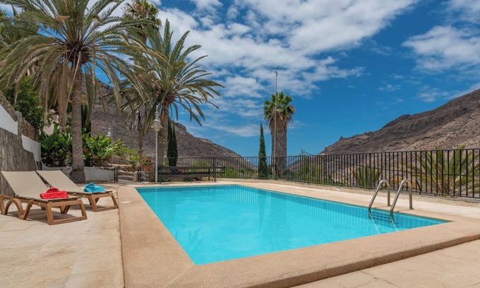 Mogan Casa | GC0285 Casa de vacaciones con piscina compartida en Mogán