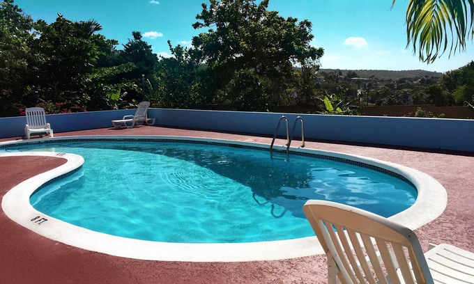 IronShore Estates Casa | Encuentre la sensación de estar en casa en nuestro encantador 6 habitaciones ubicado cerca del mar Caribe