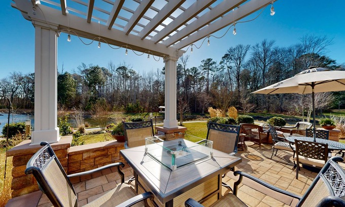 West Beach Casa | Gorgeous Bay Forest home with resort amenities, raised patio, office, & firepits