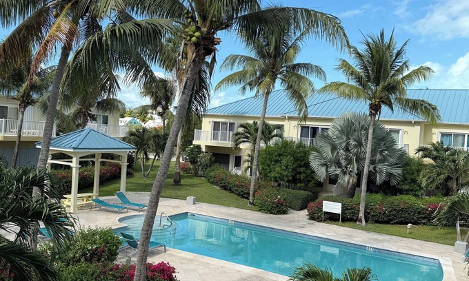 Grace Bay Hills Casa | Grace Bay Escape - Walk to #1 Beach & Grace Bay Strip. 2 Bedrooms, Shared Pool