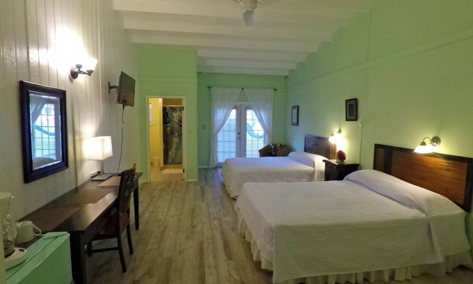 Cockburn Town Casa | Grand Turk Vibes B&B - Balcony room, with 2 queen beds with partial ocean view!