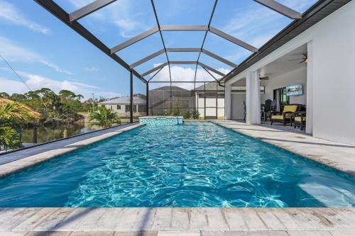 Burnt Store Casa | Gulf Access Home, Heated Saltwater Pool & Spa, Dock and Tiki Hut - Villa Perchside Palace