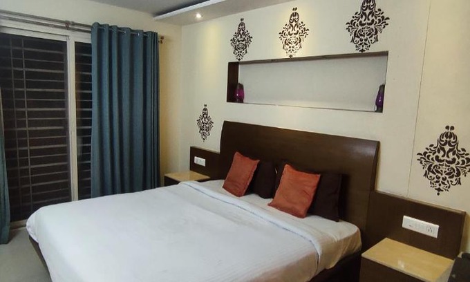 Gokulam Apartamento | Happy Vibes studio flats - service apartment