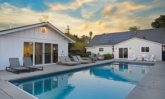 Sonoma Casa | Family Friendly Palmer Farmhouse Pool Spa Putting Green Walkable to DT