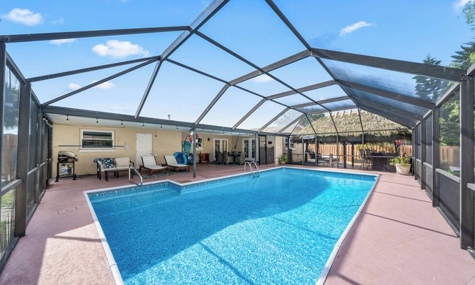 Holiday Cove Casa | Heated Pool, BBQ Grill, & Tiki Bar near USSSA and Cruise Port Canaveral