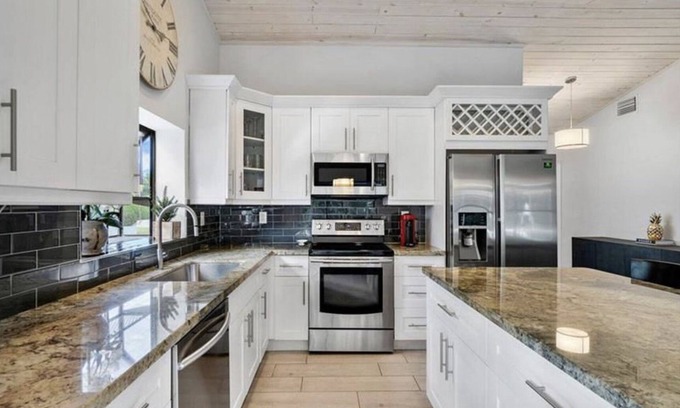Lake Ida Shores Casa | Heated Saltwater Pool! Beautiful Activity Filled Three BR Home Downtown Delray