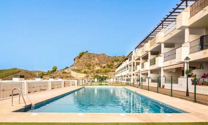 Enix Apartamento | Apartamento vacacional "Oasis En Enix" con vistas al mar, piscina compartida y Wi-Fi