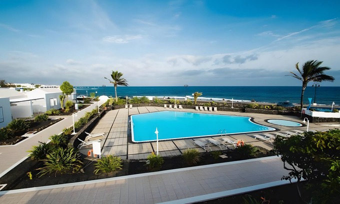 Arrieta Casa | Casa Vacacional 'Caleta Campos 2' con Vista al Mar, Piscina Compartida y Wi-Fi