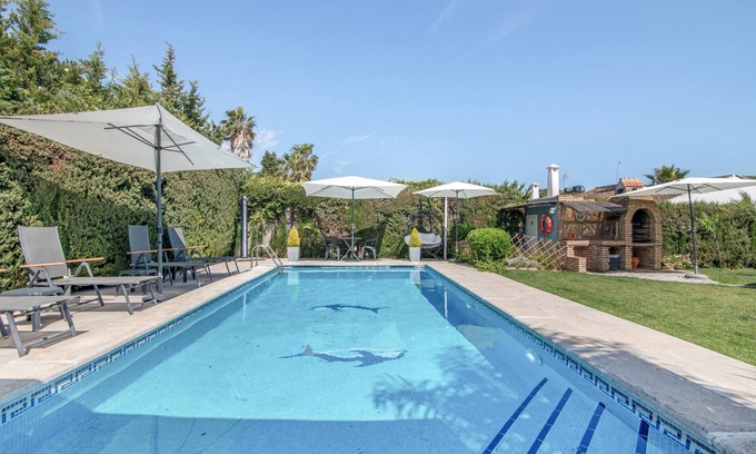 Aljaraque Casa | Casa de vacaciones 'Golf Azul' con piscina compartida, Wi-Fi y aire acondicionado