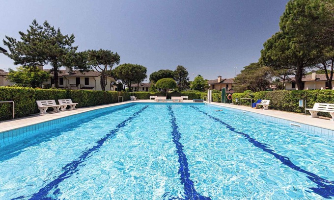 Porto Santa Margherita Casa | Casa vacacional con piscina comunitaria y pista de tenis
