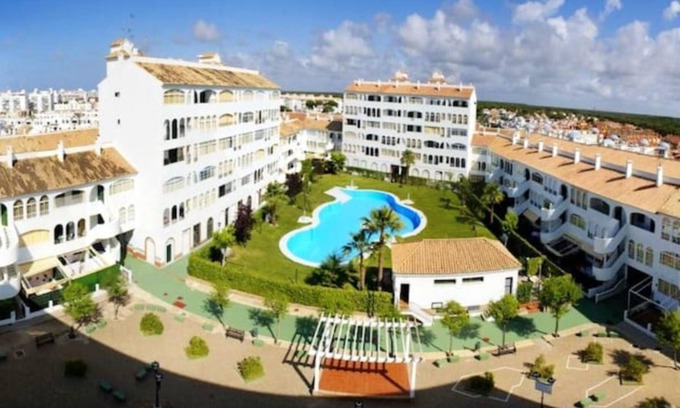 El Portil Apartamento | Homerez - Apartamento a 1 km de la playa para 6 pers. con piscina compartida