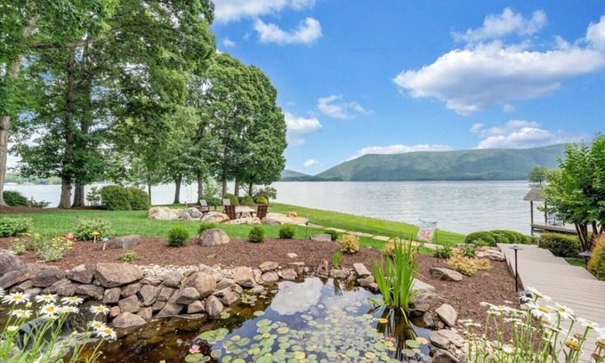 Huddleston Casa | Hook & Paddle - Luxury home on SML with kayaks and private dock.