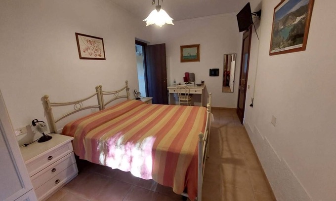 Iglesias Historic Centre Apartamento | House The Ancient Olive Tree, nestled in a centuries-old olive grove with a large garden around it.