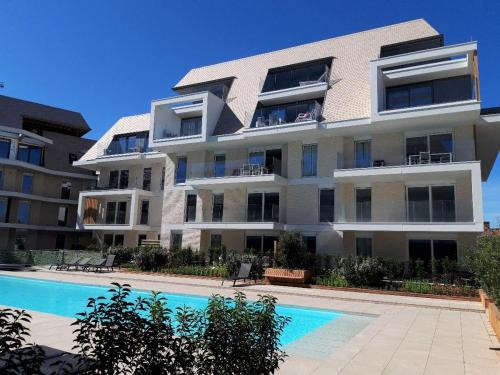 Nieuwpoort Apartamento | Huswell - Family-friendly apartment in Nieuwpoort with shared summer pool