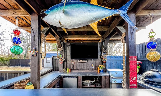 Fayetteville Casa | Ideally located home with enclosed yard, tiki bar, grill, smoker, & smart TVs