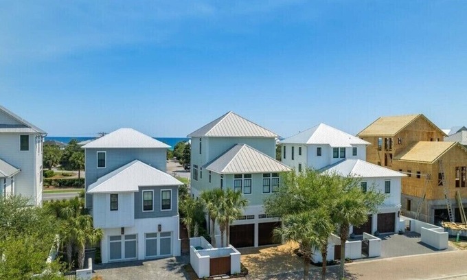 SeaNest Village Casa | includes golf cart! SeaNest stunner with Gulf views, 4 adult bikes. EV charger