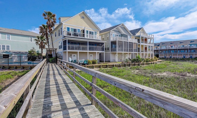 Waters Edge Casa | Inviting waterfront townhouse with beach access, balcony, W/D, pool & dock
