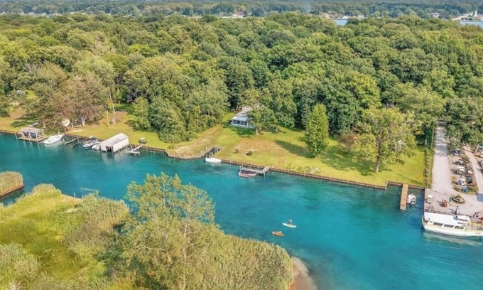 Algonac Cabaña | Island, house cottage. Lakefront property with boatlift and seawall.