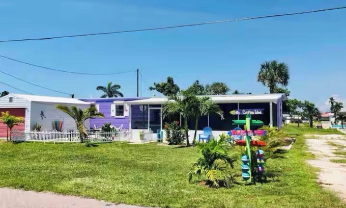 Flamingo Bay Casa | ISLAND TIME! DOCK! POOL! KAYAKS! BOAT To BEACH! PETS ALLOWED! The Purple House
