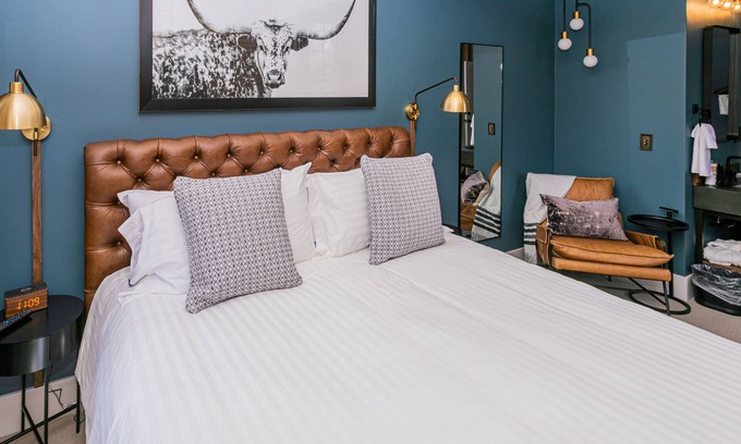 Jacksonville Hotel | Jacksonville Inn Room #8: King Suite. Prime downtown location for festivals and dining. Comfortable king bed, Nespresso coffee, and historic boutique elegance