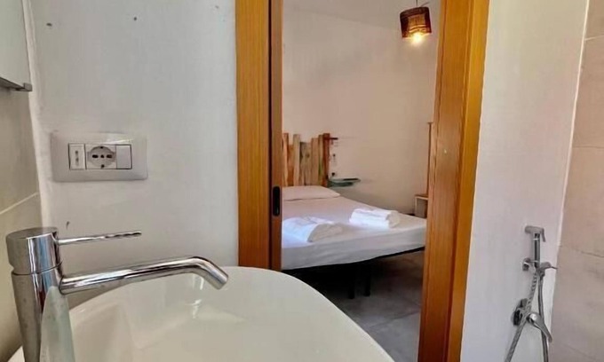 Porto Torres Apartamento | Habitación Ginepro - Habitación full service con baño privado
