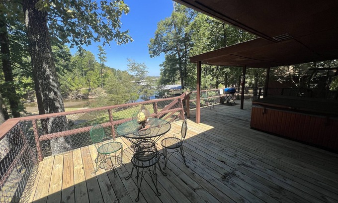 Mount Ida Casa | Lake side three bedroom, two bath house on Lake Ouachita with private hot tub. by RedAwning