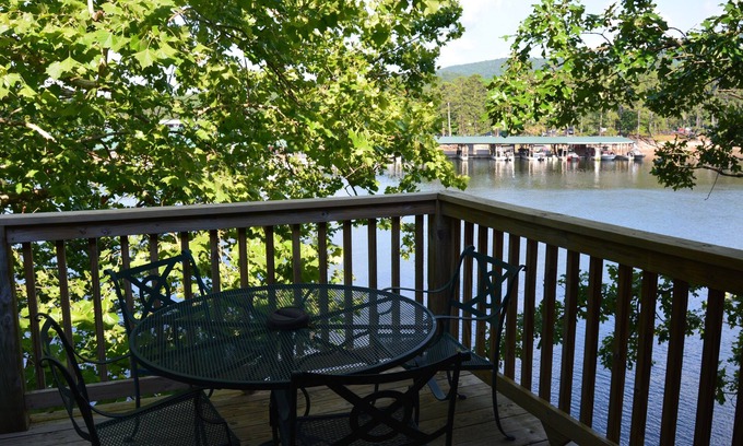 Mount Ida Cabaña | Lake view two bedroom, two bath log-sided, luxury Harbor North loft cottage with hot tub overlooking Lake Ouachita. by RedAwning