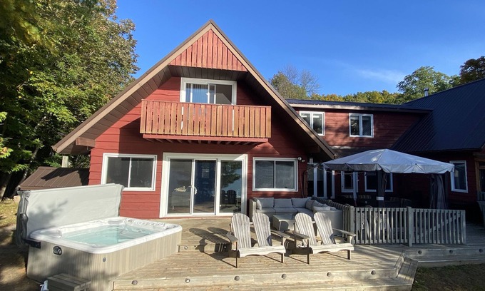 Leeds and the Thousand Islands Cabaña | Lakefront, colourful sunsets, hot tub, arcade. Year round fun and relaxation.