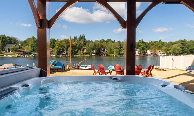 Lake Harmony Casa | Luxurious 6-bedroom lakefront Poconos home with a deck, private beach, fire pit and hot tub