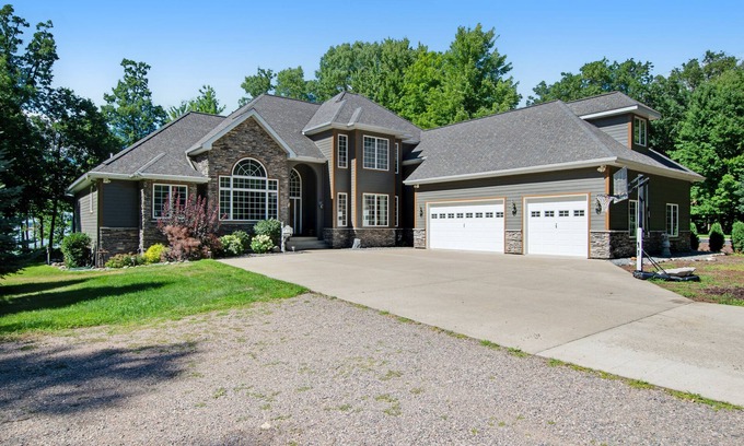 Arkdale Casa | Lakefront estate with firepit, grill, game room & sauna - near Sand Valley Golf