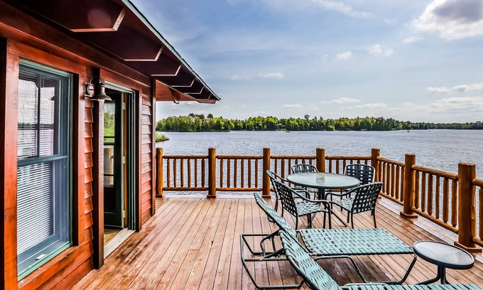 Manitowish Waters Condominio | Lakefront home with large deck, gas grill, wood fireplace, heated pool, firepit