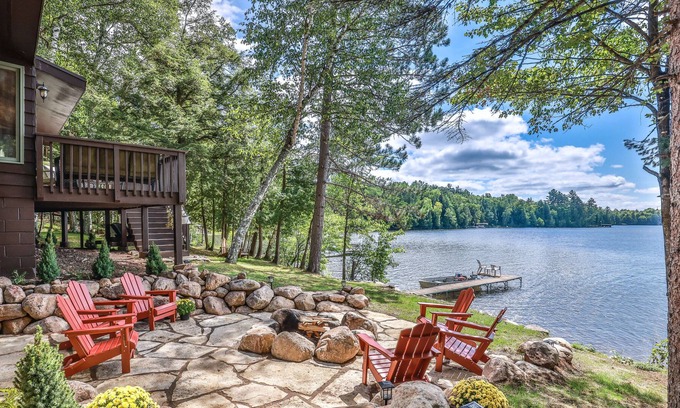 Presque Isle Cabina | Lakefront home on snowmobile trail with kayaks/SUP, fireplace, game room & AC