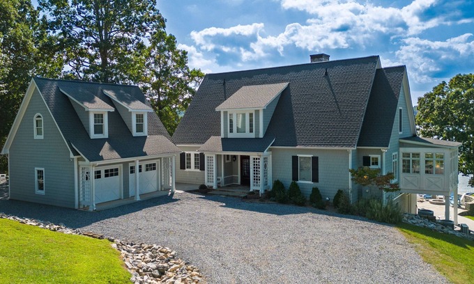 Moneta Casa | Lakefront home with amazing views, dock, firepit, foosball, patio, garage studio