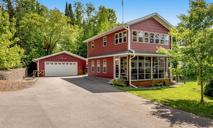 Arbor Vitae Casa | Lakefront home with dock, fireplace, deck, firepits & fast WiFi - dog-friendly