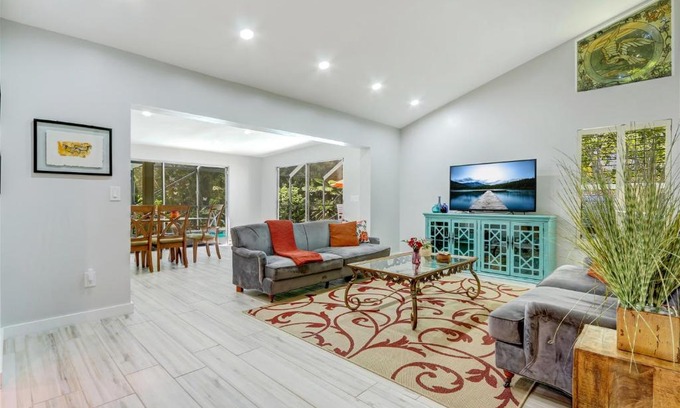 Central Naples Casa | Lakefront, Pool, outdoor kitchen, lush garden