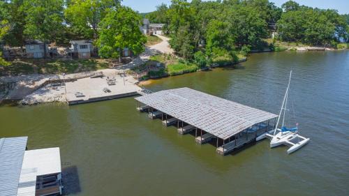 Lake Ozark Casa | Lakeshore Fishing Cabin 5, dock, boat slip and firepit area
