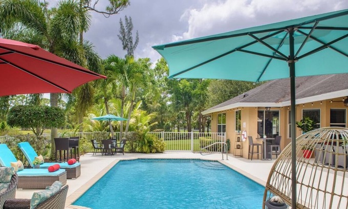 Greenacres Villa | Lakeside Paradise W/Heated Pool near the Beach