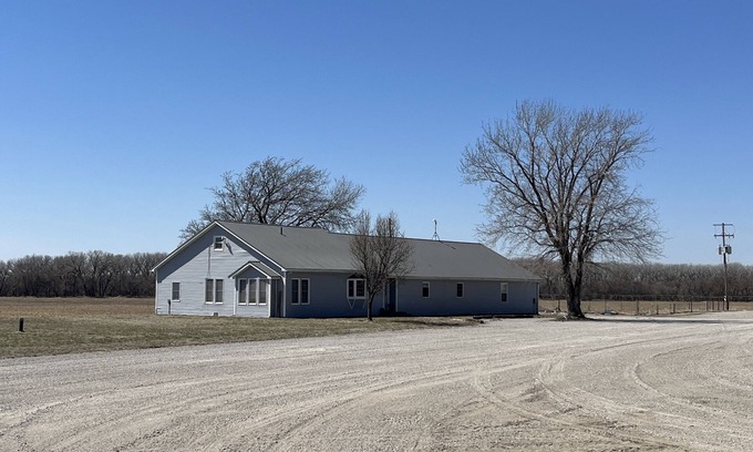 Republic County Casa | Large house surrounded by farm land along the Republican River.