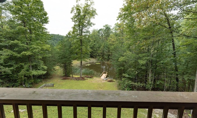 Zoe Cabina | Large Log home, private pond with dock, canoe, pool table, hot tub & internet.