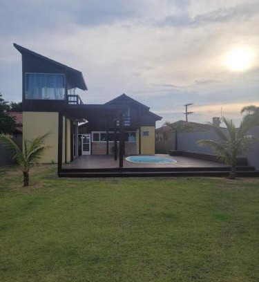 Ibiraquera Casa | LINDA CASA COM PISCINA DE FRENTE PARA A LAGOA